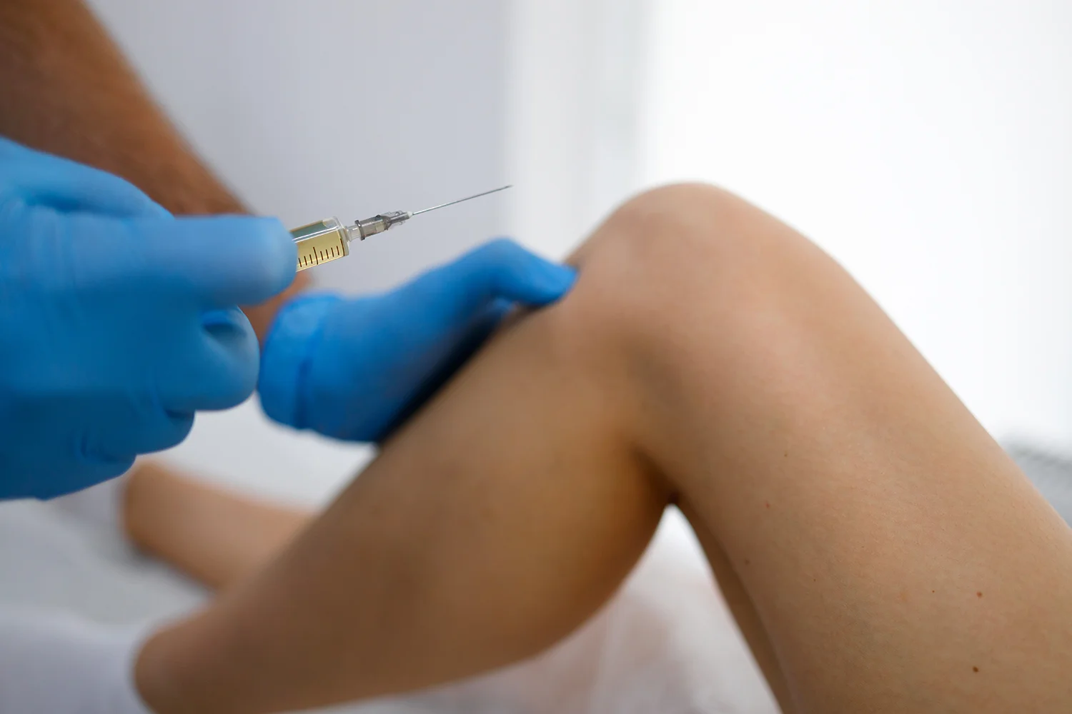 close up view pf doctor hands with syringe
