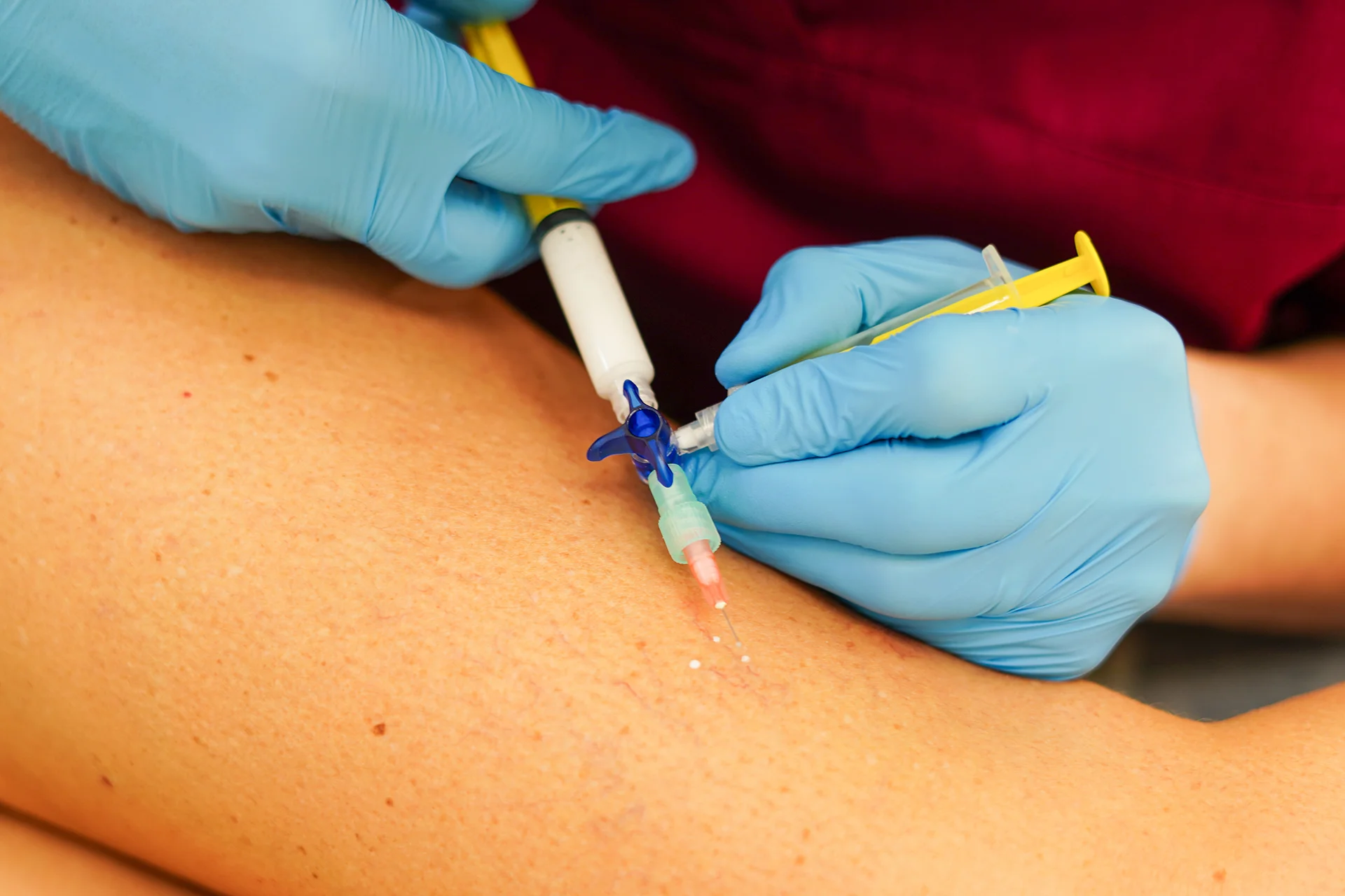medical professional administering injection hero