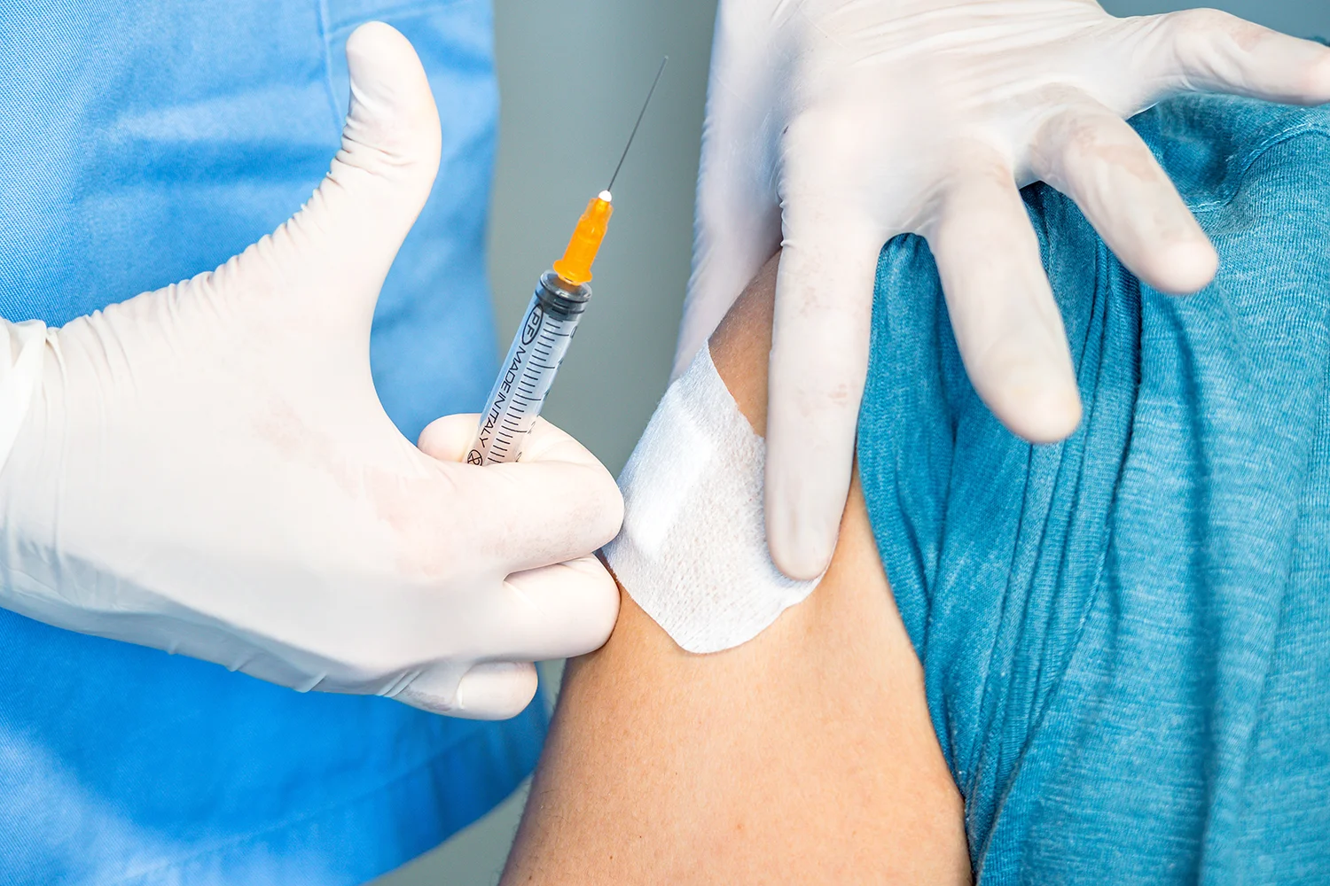vaccination with syringe and gloves